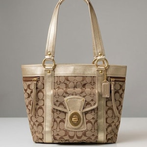 May include: A tote bag featuring a brown and tan monogram pattern with metallic gold leather trim, dual shoulder straps, two side zippered pockets, and a central exterior pocket secured by a gold-toned turn-lock closure with a hanging leather tag.