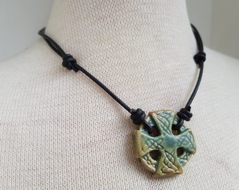 Green Celtic cross in stoneware clay black leather necklace