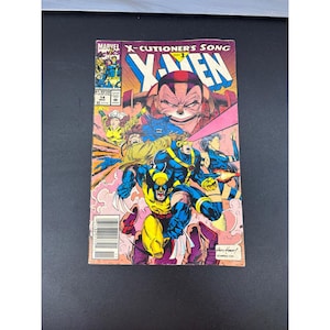 May include: A Marvel Comics X-Men issue 14 comic book titled X-Cutioner's Song Part 3. The cover features colorful illustrations of characters including Wolverine, Cyclops, and Rogue against a pink and yellow background with bold text.
