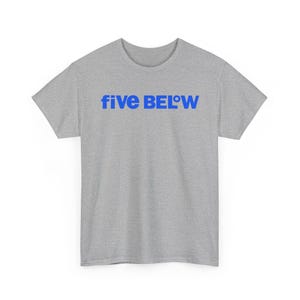 May include: A heather gray short-sleeve t-shirt featuring the text five BEL°W printed in bold blue letters across the chest. The garment has a crew neckline and a standard fit, showcasing a simple design with a clear brand logo on the front.