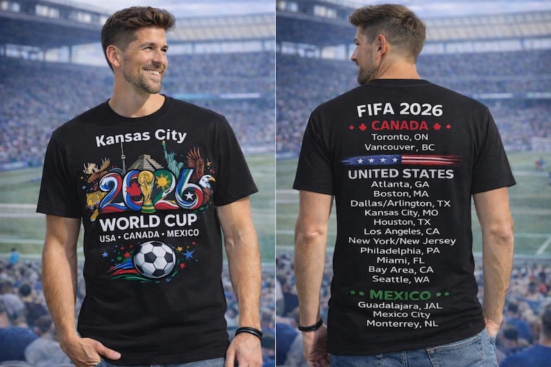 May include: Black t-shirt with "Kansas City 2026 World Cup" graphic. The front features a soccer ball and the flags of USA, Canada, and Mexico. The back lists FIFA 2026 host cities in Canada, the United States, and Mexico.
