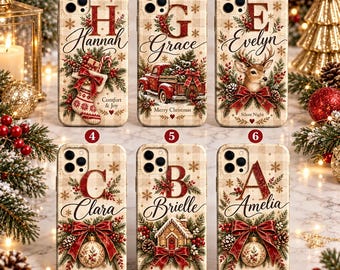May include: Six phone cases with a beige plaid background, each featuring a large red letter, a personalized name, and Christmas-themed illustrations including stockings, a red truck, a deer, and ornaments, all accented with pine and red berries.