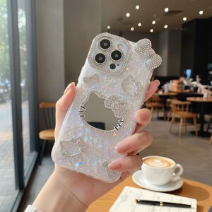 Funda para teléfono con espejo de Hello Kitty, funda kawaii con purpurina para iPhone con espejo de maquillaje, funda a prueba de golpes estilo Sanrio. imagen 3