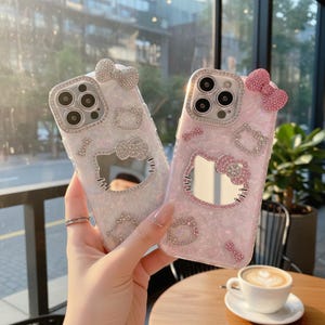 Funda para teléfono con espejo de Hello Kitty, funda kawaii con purpurina para iPhone con espejo de maquillaje, funda a prueba de golpes estilo Sanrio. imagen 1
