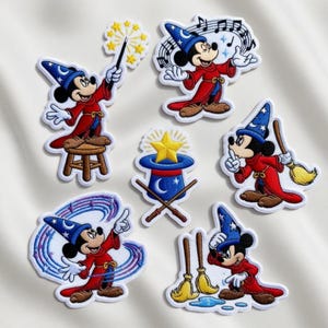 May include: Set of embroidered patches featuring Mickey Mouse in various poses as a sorcerer. Each patch shows Mickey in a red robe and blue wizard hat, with details like musical notes, a magic wand, and a broom. The patches have white borders.