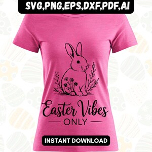 May include: A pink t-shirt featuring a black graphic of a rabbit surrounded by leaves and flowers. The text "Easter Vibes ONLY" is below the graphic. The words "INSTANT DOWNLOAD" are at the bottom.