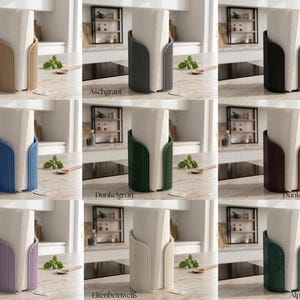 May include: A collection of nine cylindrical paper towel holders featuring vertical ribbed textures, displayed in various colors including beige, gray, black, blue, dark green, brown, light purple, cream, and dark green sparkle.