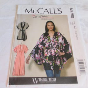 May include: McCall's sewing pattern M7790 for a loose-fitting robe with a floral print. The pattern includes instructions for making a robe with a V-neck, long sleeves, and a tie belt. The pattern is designed for sizes ZZ (18-22).