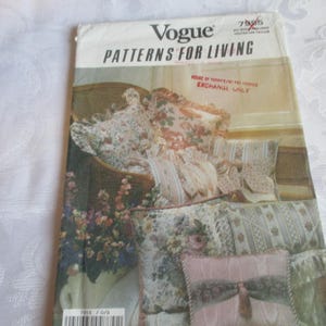 May include: A vintage Vogue Patterns for Living sewing pattern. The cover features a floral design with pillows and a bedspread. The text "HOUSE OF PATTERNS FOR FABRICS EXCHANGE ONLY" is visible. The pattern number is 7955.
