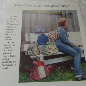 May include: A printed advertisement for the Diva Essential Designer Bag featuring multiple fabric backpacks in various floral and patterned designs. The text describes the item as a versatile bag that functions as both a purse and a backpack.