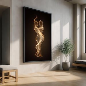 May include: A framed art print featuring an abstract depiction of two figures embracing. The artwork is rendered in flowing, golden hues against a dark background, creating a sense of warmth and intimacy. The print is displayed in a modern, minimalist interior setting.