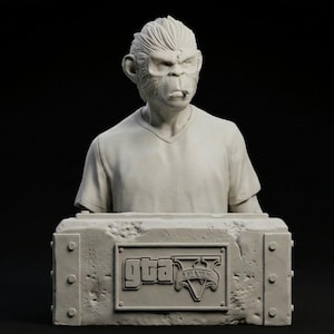 May include: A gray bust sculpture of a chimpanzee-human hybrid wearing a v-neck shirt. The sculpture rests on a rectangular base with the "GTA V" logo. The background is black.