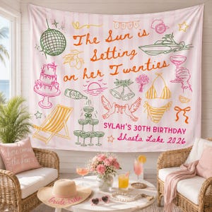 May include: A pink and white striped fabric backdrop featuring orange text that reads The Sun is Setting on her Twenties, with illustrations of a disco ball, boat, cake, champagne tower, bikini, and doves. Text includes SYLAH'S 30TH BIRTHDAY Shasta Lake 2026.