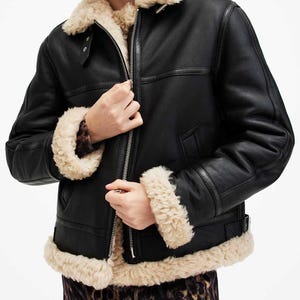 May include: A set of three ceramic mugs with a speckled, matte finish. The mugs are in shades of cream, light gray, and dark gray. Each mug has a simple, minimalist design, perfect for coffee or tea.