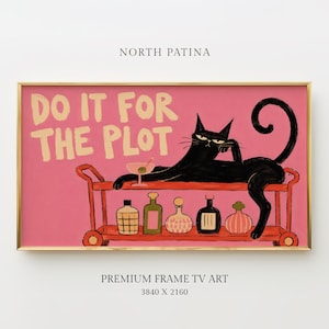 May include: A framed digital art print featuring a black cat lounging on a red bar cart filled with various bottles and a martini glass against a pink background. The text DO IT FOR THE PLOT is written in large yellow letters above the cat.