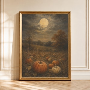 May include: A framed wall art print depicting a nighttime pumpkin patch under a full moon. The scene features orange and white pumpkins scattered across a field with dark trees and a cloudy sky. The artwork is enclosed in a gold-colored frame.