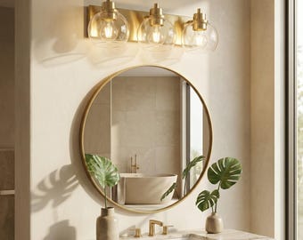 Aplique de baño moderno de 3 luces con acabado en latón cepillado.