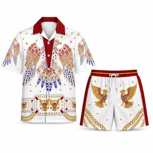 May include: A short-sleeve button-down shirt and matching shorts set in white, featuring a repeating pattern of golden eagles adorned with red and blue gems, gold chains, and small stars, with solid red collar and side panel accents.
