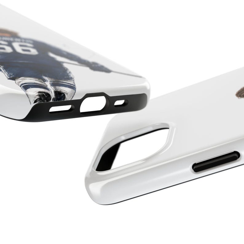 May include: White phone case with a black border. The case features a hockey player in a blue and white uniform. The player's number 66 is visible on the jersey. The case is designed to protect the phone.