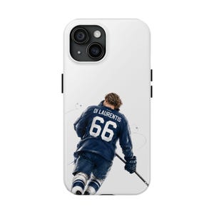 May include: White phone case featuring a hockey player in a blue jersey with the name "Di Laurentis" and the number "66". The player is skating with a hockey stick, set against a white background.