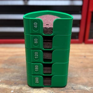 May include: A set of three ceramic mugs with a speckled, matte finish. The mugs are in shades of cream, light gray, and dark gray. Each mug has a simple, minimalist design, perfect for coffee or tea.