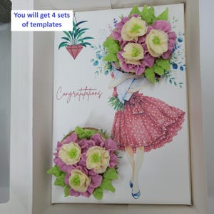 May include: A greeting card with a floral design and the word "Congratulations". The card features a drawing of a woman in a red polka-dot dress holding a bouquet of flowers. The card is decorated with a 3D floral arrangement.