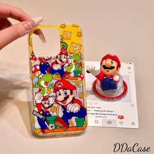 Vibrant Yellow Super Mario with Mario, Yoshi  Block Patterns Print, Paired with Red Hat Mario Rotating Stand – for iPhone 15/16/17 Pro Max