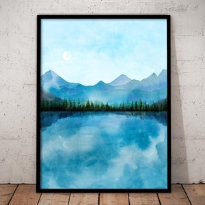 May include: A watercolor painting of a mountain range reflected in a still lake. The sky is a light blue with a single white cloud. The mountains are a dark blue and the lake is a light blue.