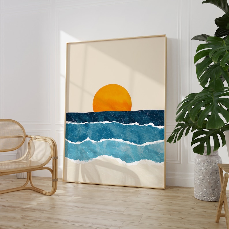 May include: A digital art print featuring a sunset over the ocean. The sun is a bright orange circle, and the waves are a deep blue with white foam.