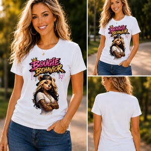 May include: A white short-sleeved t-shirt featuring a graphic print of a stylised bear character wearing a baseball cap and jewellery. The text "BOUGIE BEHAVIOR" is printed above the character in pink and yellow with a small crown and heart.