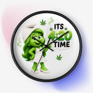 May include: A round wall clock with a black frame featuring a green cartoon character wearing a white hat and dress. The clock face displays the text ITS 4:20 TIME in a white speech bubble, surrounded by small green leaf icons and wisps of smoke.