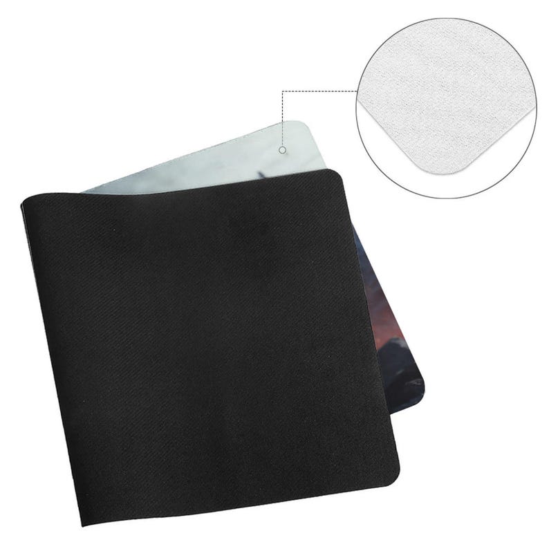 May include: A black rectangular mousepad with a textured surface. The mousepad has a printed design visible on the top edge. A close-up shows the white, smooth surface of the mousepad.