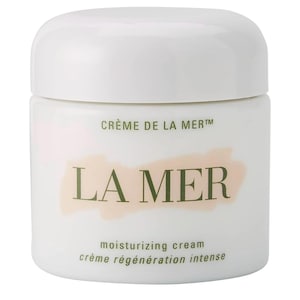 May include: A white jar of La Mer moisturizing cream. The jar has a rounded shape with a white lid. The brand name "LA MER" is printed in green, with "Crème de la Mer" above and "moisturizing cream crème régénération intense" below.
