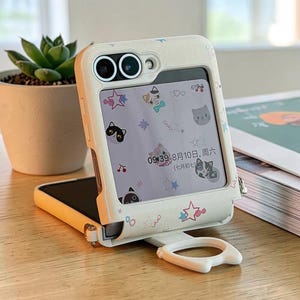 May include: A set of three ceramic mugs with a speckled, matte finish in cream, light grey, and dark grey. Each mug has a simple, minimalist design and a rounded handle.