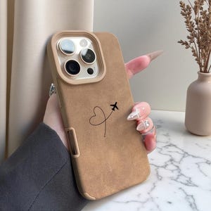 May include: A set of three ceramic mugs with a speckled, matte finish. The mugs are in shades of cream, light gray, and dark gray. Each mug has a simple, minimalist design, perfect for coffee or tea.