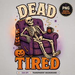 May include: A graphic illustration of a skeleton sitting in a purple armchair, holding a black mug with a jack-o'-lantern face. The text reads DEAD TIRED. A pumpkin sits on the floor, and a blanket with ghost and bat patterns hangs over the chair.