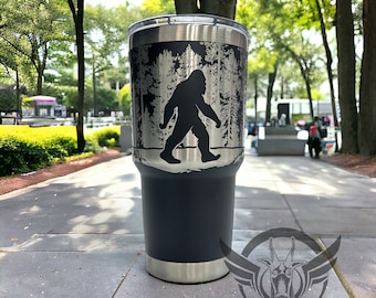 30oz tumbler engraved with Sasquatch walking in trees, Comes with magnetic slide lid, add names or text for a person touch.