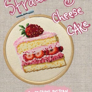 May include: A cross-stitch pattern featuring a slice of strawberry cheesecake. The design is in a wooden embroidery hoop and includes the words "Strawberry Cheese Cake" in pink script. The words "Cross-Stitch Pattern" are also included.