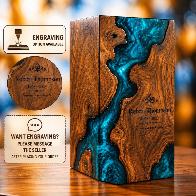 May include: A rectangular wooden cremation urn featuring a vibrant blue resin river inlay. The wood displays natural grain patterns and knots. Engraved text reads: Robert Thompson, 1948-2023, Forever in our hearts. Includes icons for engraving.