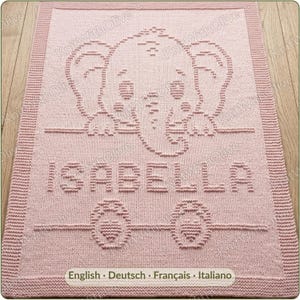 May include: A rectangular light pink knitted blanket featuring a textured elephant graphic at the top, the name ISABELLA in capital letters in the center, and two small heart shapes at the bottom, all framed by a ribbed border.