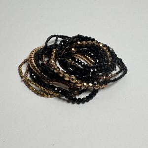 Black & Gold Stretch Bracelets (set of 16) - “Shine through the night”