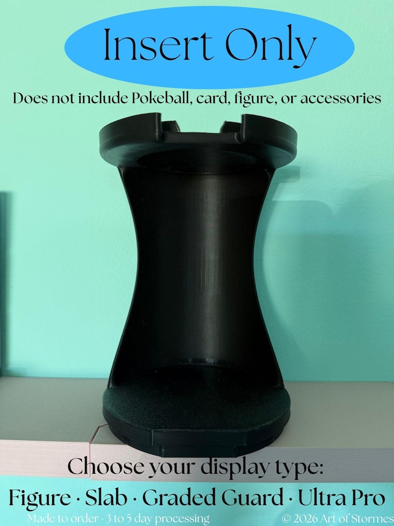 May include: A black display stand with a concave vertical body and a circular base. The text reads: Insert Only, Does not include Pokeball, card, figure, or accessories, Choose your display type: Figure, Slab, Graded Guard, Ultra Pro, 2026 Art of Stormes.