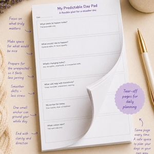 May include: A white paper planning pad titled My Predictable Day Pad with sections for daily tasks, unexpected changes, and anchors. The pad features tear-off pages, purple text, and prompts for planning daily routines, transitions, and priorities.