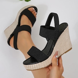 May include: A rustic wooden sign with the text "Welcome to our home" in white lettering. The sign features a distressed finish and a simple, inviting design, perfect for entryway decor.