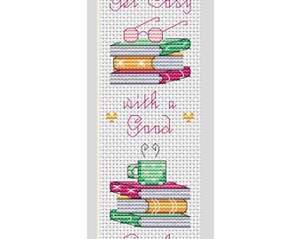 May include: Cross-stitch bookmark with the text "Get Cozy with a Good Book." The design features stacks of books, glasses, and a mug. The colour palette includes pink, green, yellow, and white, creating a cosy and inviting aesthetic.