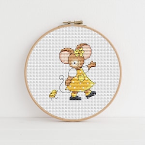 May include: A cross-stitch embroidery hoop with a yellow and brown mouse wearing a yellow dress with white polka dots and a yellow flower in her hair. The mouse is holding a yellow string attached to a small yellow chick.