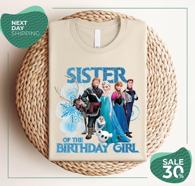 A t-shirt with a design featuring characters from the Disney movie Frozen, specifically the sisters Elsa and Anna, along with the text "SISTER OF THE BIRTHDAY GIRL".