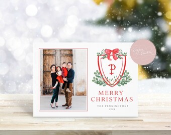 May include: Christmas card featuring a family photo and a festive design. The card includes a family portrait and a watercolor crest with a red bow, greenery, and the text "Merry Christmas".