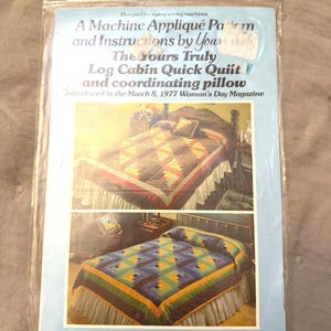 May include: A vintage sewing pattern for a Log Cabin Quick Quilt and coordinating pillow, designed for zigzag sewing machines. The pattern includes instructions and comes in four standard sizes. The package features images of the finished quilt on a bed.