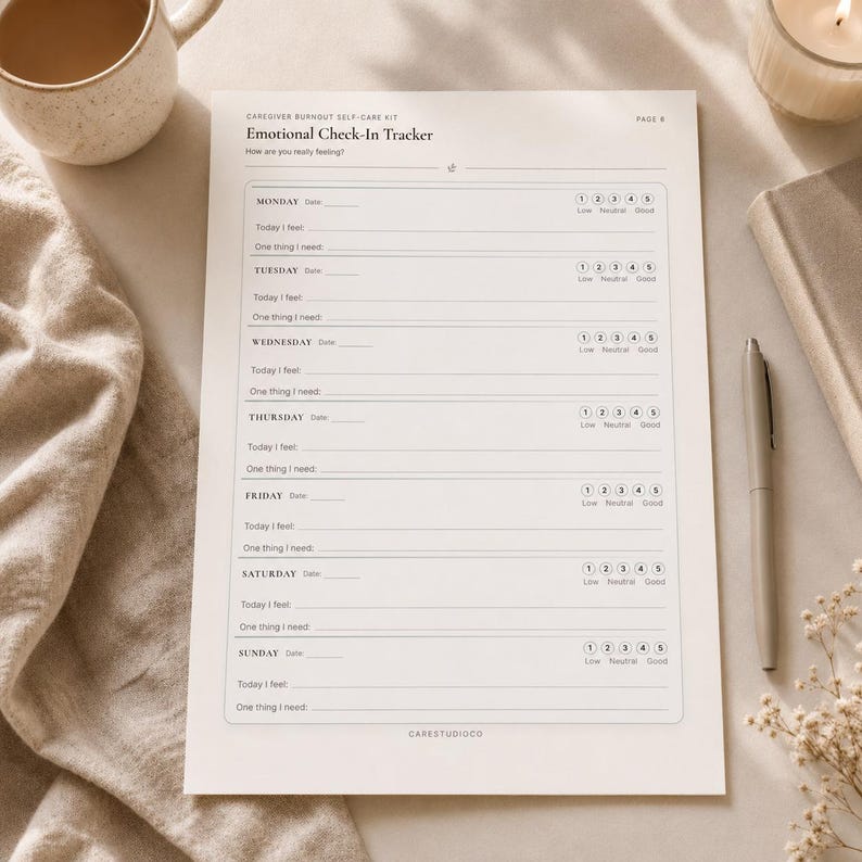 Printable Emotional Check-In Tracker worksheet for caregiver self-care shown on a beige flat lay with a mug, candle, notebook, pen, and dried flowers.